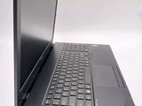 a black laptop with a black keyboard on a white surface