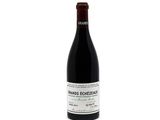 a bottle of wine that is sitting on a table