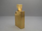 a gold lighter that is sitting on a table