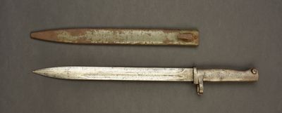 two old knives that are on a table