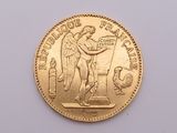 gold coin with a statue of an angel on it