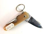 a small pocket knife with a keychain attached to it