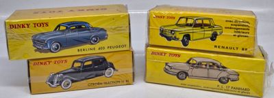 three boxes of toy cars sitting on top of a white surface