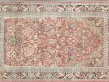 tapis persan ancien à motif floral sur fond bleu
