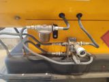 a close up of a machine with a hose attached to it