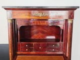 an antique wooden desk with drawers and a drawer underneath it