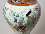 a vase that is sitting on a stand on a white surface