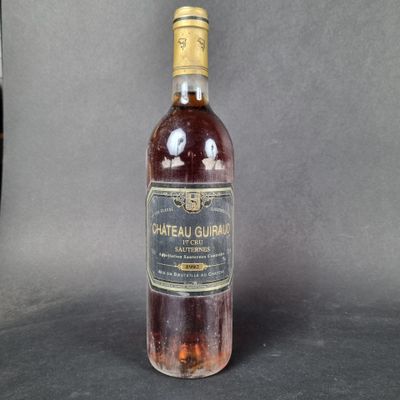a bottle of wine that is sitting on a table