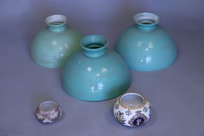 three vases sitting on a table next to each other