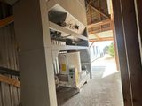 a room that has a stove and a refrigerator in it