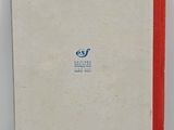 a white book with a red line on the cover