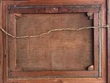 an old wooden picture frame with a rope hanging from it
