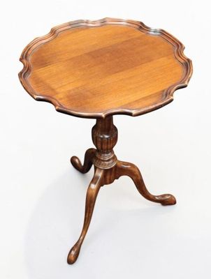 an image of a small table with a wooden top