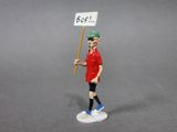 a figurine of a man with a sign in his hand