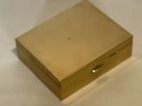 a gold box sitting on a white surface