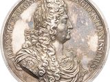 une vieille pièce d'argent sur laquelle figure la tête d'une femme coiffée d'une couronne