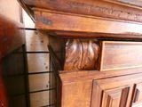 a close up of a wooden cabinet with carvings on it