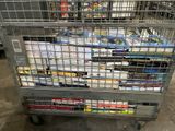 a metal cart with many items in it in a warehouse