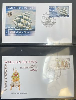 two envelopes with a picture of a ship on them on a table