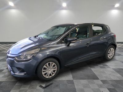 the blue car is parked in the garage on a checkered floor