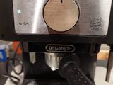 a black coffee maker sitting on top of a counter