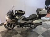 a motorcycle that is parked on a checkered floor