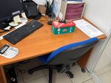 a desk with a computer monitor and a keyboard on it