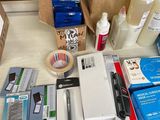 a table with a lot of office supplies on it
