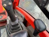 a close up view of a steering control of a tractor