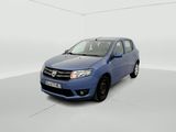 the small blue car is parked in a white room