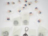 a lot of bags of tea bags and a keychain on a table
