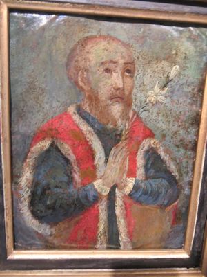 tableau représentant un homme vêtu d'une robe rouge et bleue tenant une fleur blanche