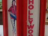 a red and white sign with a picture of a woman on it