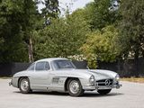 an old mercedes sports car parked in a parking lot