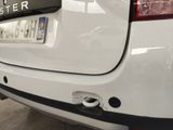 a close up of a white car with a license plate on it
