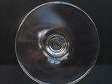 a close up of a wine glass on a table