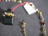 a necklace and earring that are on a table