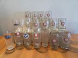 a lot of glasses sitting on a wooden table