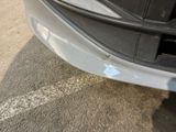 a close up of a car ' s bumper with a sticker on it