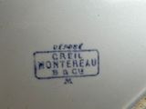 a close up of a plate with a sign on it
