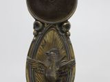 bronze statue of an elephant with a bird on it ' s back