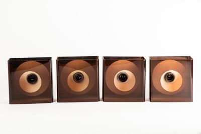 three speakers that are sitting next to each other on a table