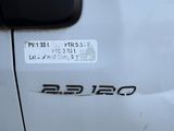 a close up of a white truck with a sticker on it