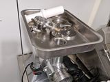a kitchen with a sink and a stove with pots and pans in it