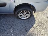 a small car that has a flat tire on it