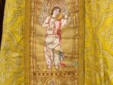 yellow brocadel with a picture of a man holding a sword