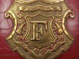 a close up of a helmet with a shield on it