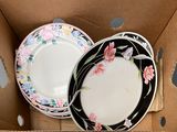 two plates in a box that are sitting on a table