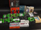 many electronic devices that are on display on a table