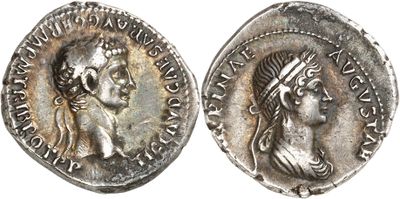 a silver coin with an image of a woman and a man on it